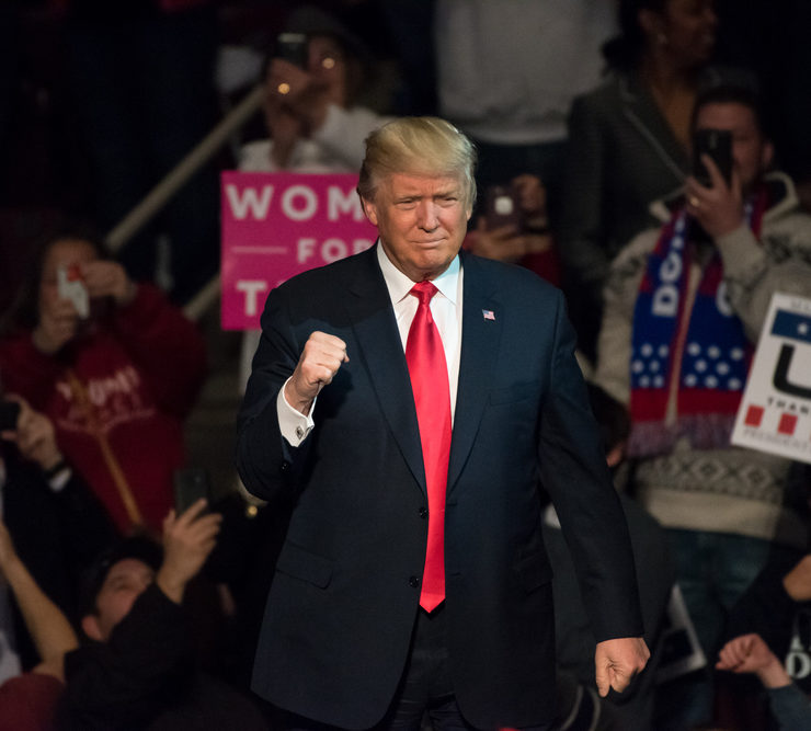 HERSHEY, PA - DECEMBER 15, 2016: President-Elect Donald Trump gives a "Fist Pump" to the crowd as he arrives on stage to deliver a speech at a "Thank You" Tour rally at the Giant Center.